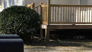 A single-story house with a porch, a door, and a mailbox. - 3 bedroom home located within a mile from downtown (Sumter)
