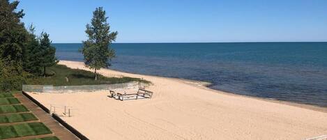 On the beach, sun-loungers