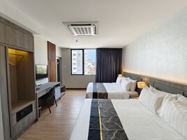 Family Quadruple Room | Minibar, desk, blackout drapes, iron/ironing board