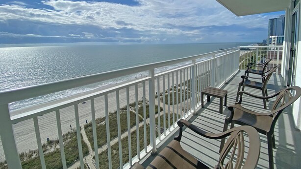 A balcony with a view of the ocean and beach. - Camelot by the Sea by Palmetto Vacations (Myrtle Beach)