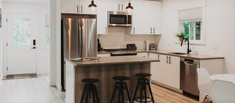 Spacious and modern 2 bedroom 2 bathroom cottage with private yard.