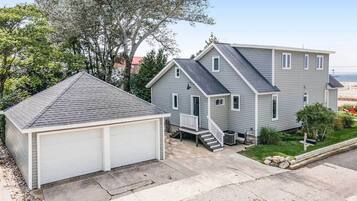 Stroll up to the front porch and enter this serene two-story home surrounded by a well-maintained lawn and trees.