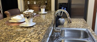 Lovely bedroom beautifully decorated with a smart tv .