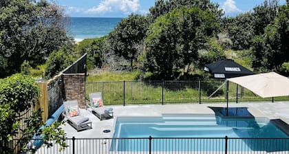 Absolute beachfront holiday home with private heated pool