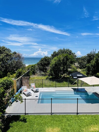 Absolute beachfront holiday home with private heated pool