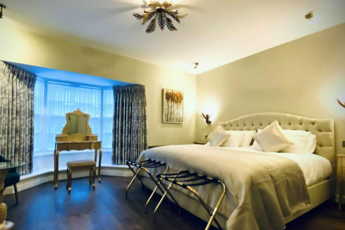 Chic Room | Desk, laptop workspace, blackout drapes, iron/ironing board