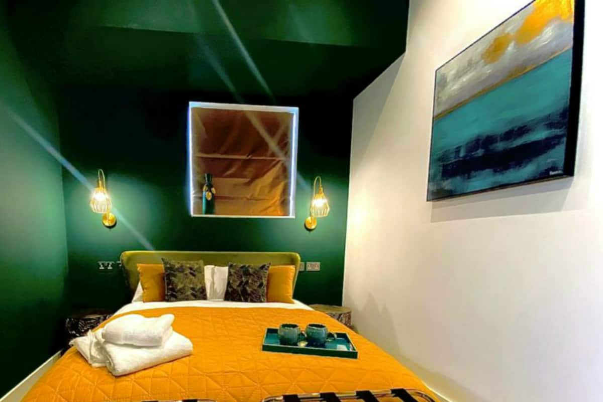 Green Leaf Room | Desk, laptop workspace, blackout drapes, iron/ironing board