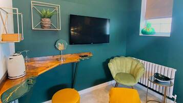 Green Leaf Room | Desk, laptop workspace, blackout curtains, iron/ironing board