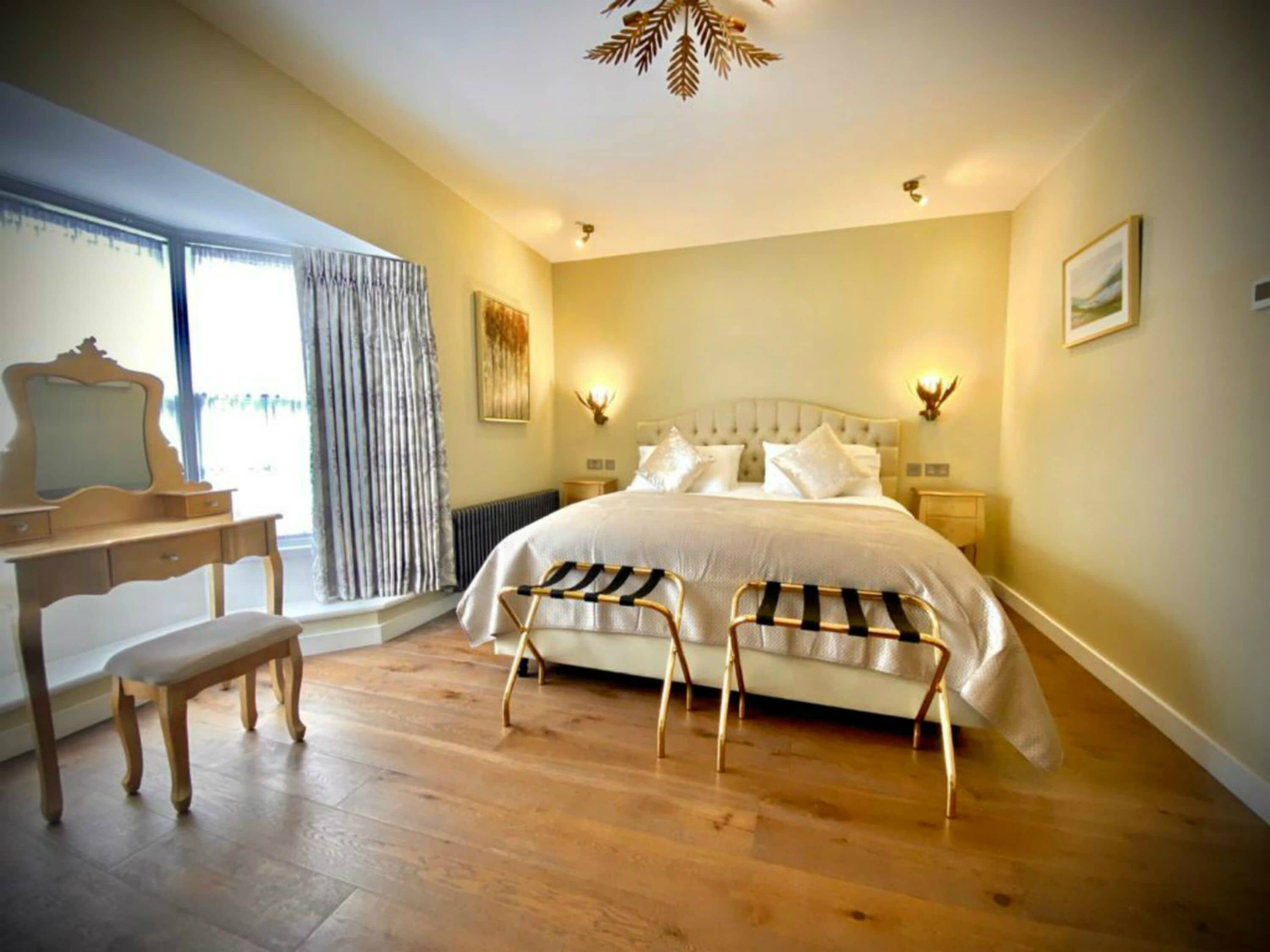 Chic Room | Desk, laptop workspace, blackout drapes, iron/ironing board