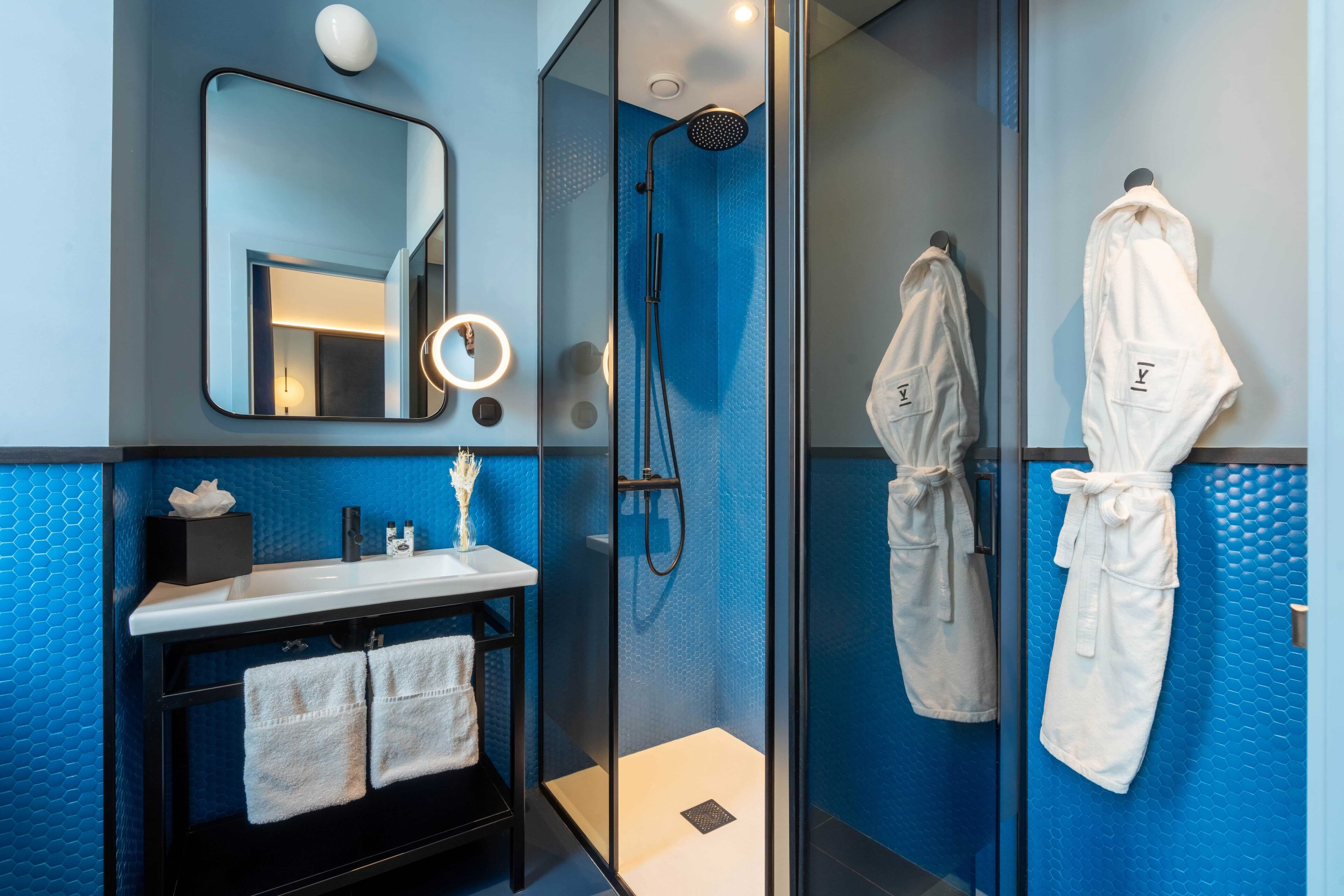 cozy twin room, station view | bathroom | shower, free toiletries, hair dryer, bathrobes