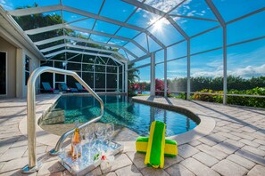 Relax by the pool surrounded by lush greenery and enjoy a refreshing swim.