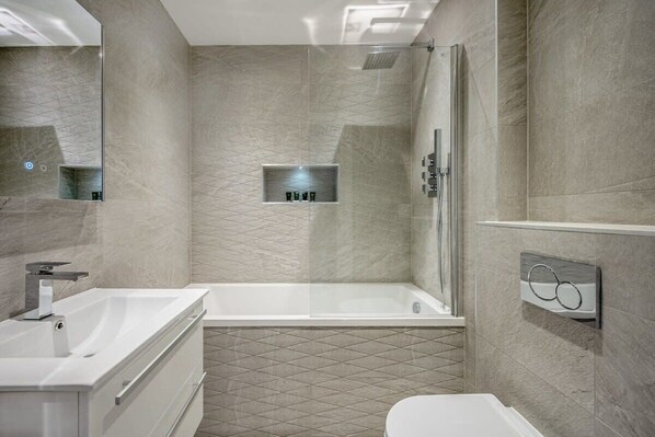 Shower, hair dryer, towels, shampoo