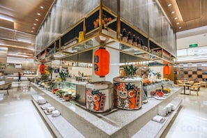 A modern interior with a central display of various items, including decorative containers and a seating area. - Ruixue International Hotel (Gao'an)