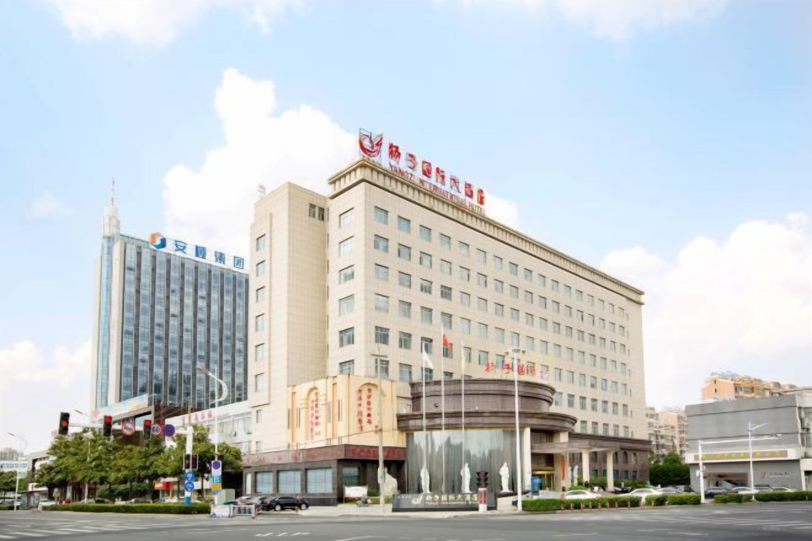 A large hotel with multiple floors and a prominent entrance.