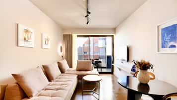 Executive Apartment | Living area | 49-inch Smart TV with satellite channels, TV