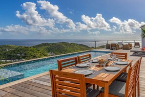 Enjoy a romantic meal with a breathtaking ocean view from this outdoor dining area.