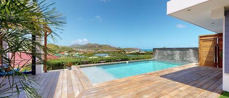 A heated pool, sun loungers