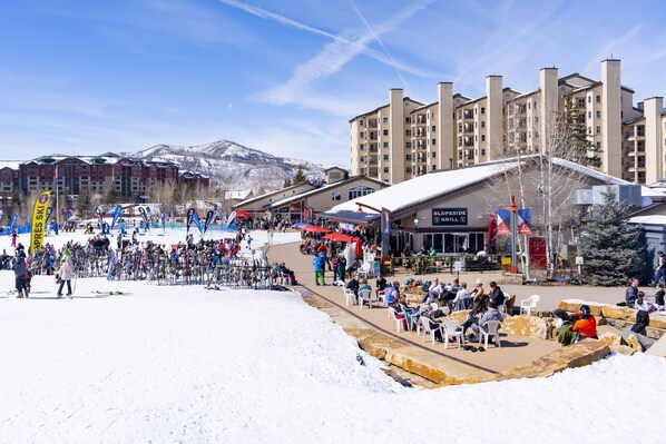 A ski resort with multiple buildings, a ski lift area, and a restaurant named 'SLOPESIDE GRILL'.