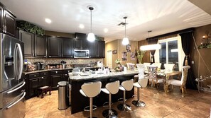 Microwave, dishwasher, coffee/tea maker, cookware/dishes/utensils