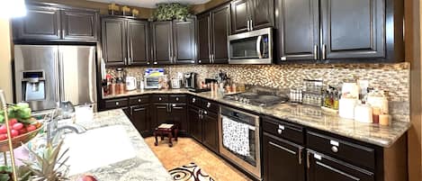 Microwave, dishwasher, coffee/tea maker, cookware/dishes/utensils