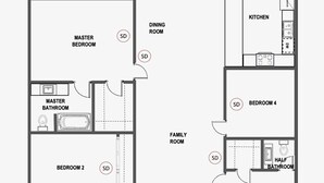 Indeling van een pand met een woonkamer, speelkamer, keuken, eetkamer en meerdere slaapkamers.