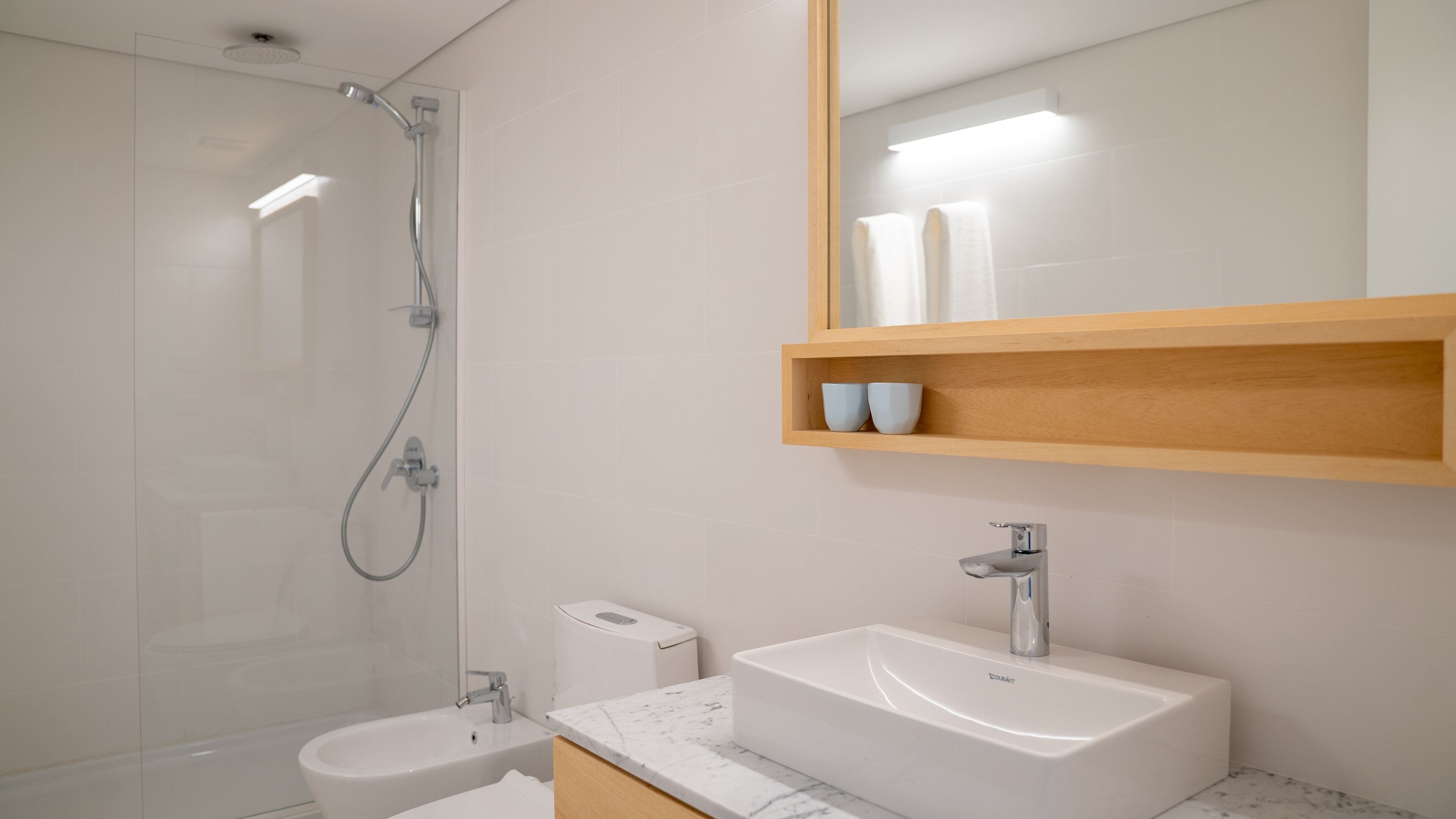 shower, hair dryer, slippers, bidet