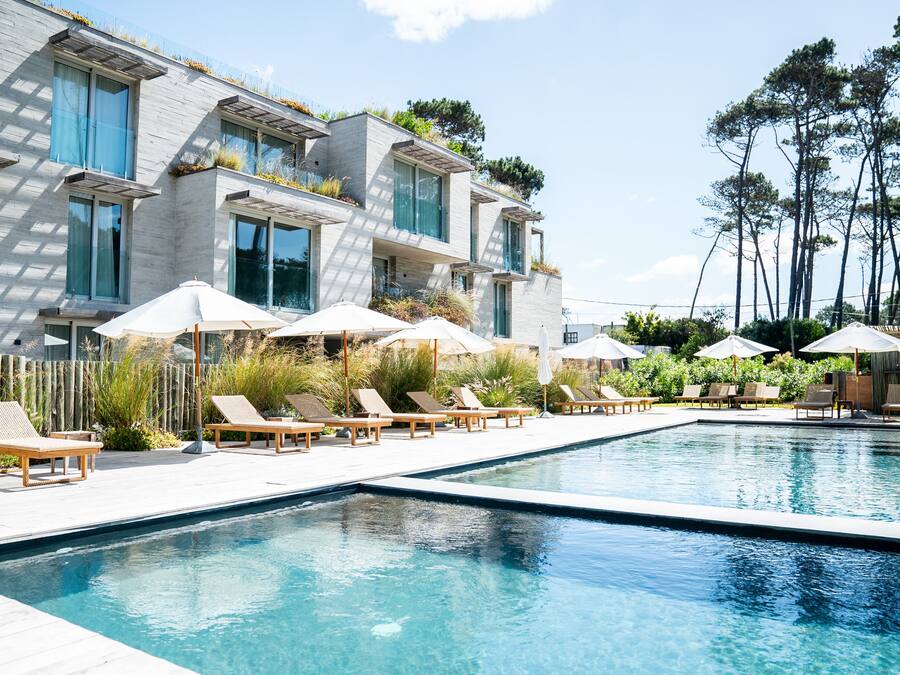 Seasonal outdoor pool, open 8:00 AM to 8:00 PM, pool umbrellas