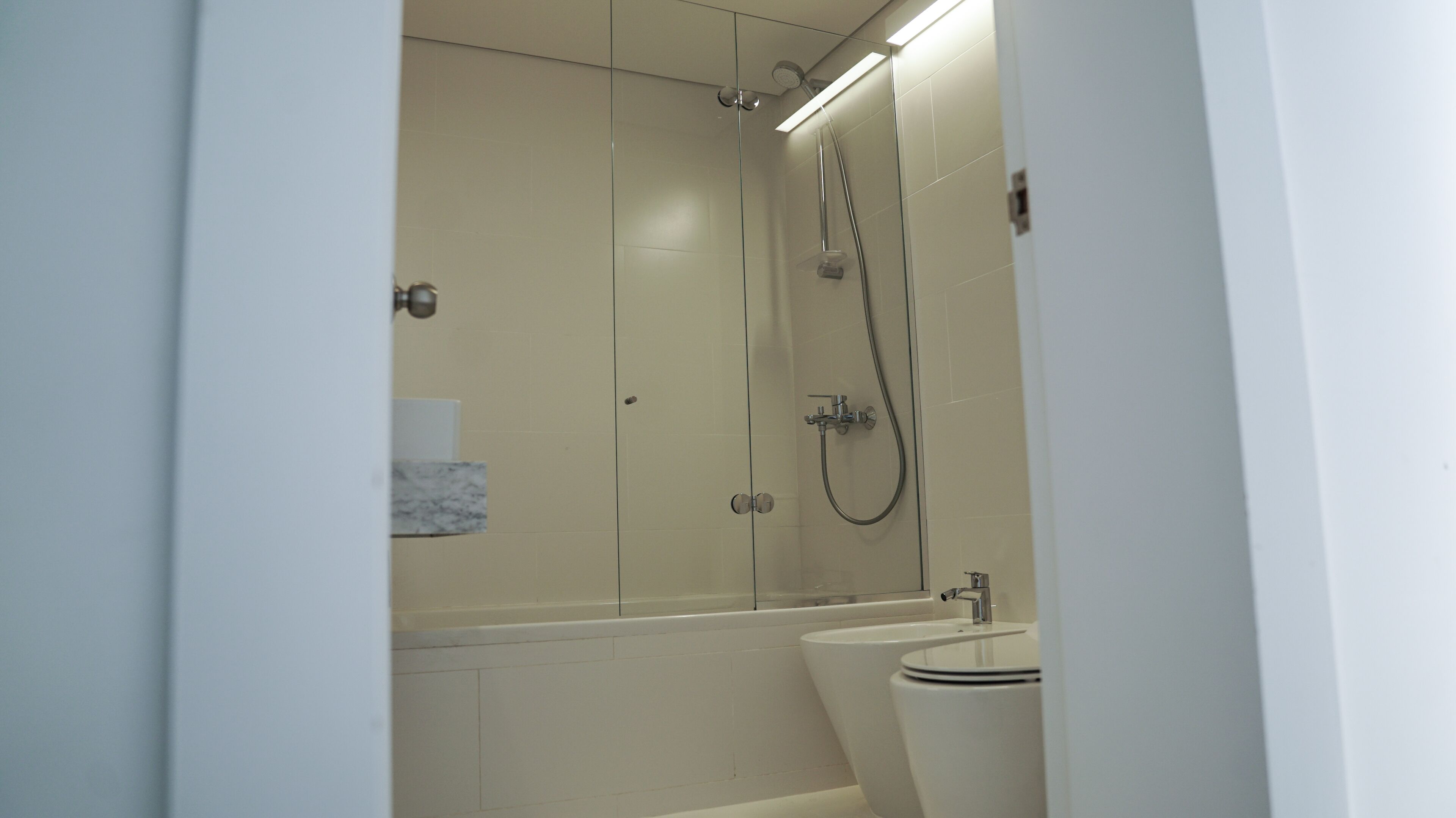 shower, hair dryer, slippers, bidet