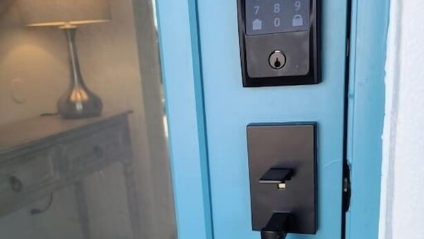 A blue door with a keypad lock and a keyhole. - 672 Casa Palmera - 3BD Heated Pool Home-Mins2Beach (Naples)