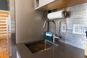 Sleek stainless kitchen with a deep sink and full prep space - Stylish Apt Near Disney and Airport (Santa Ana)