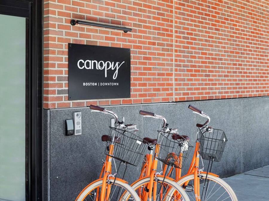 A brick building with a sign reading "canopy BOSTON DOWNTOWN".