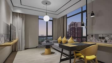 Deluxe Suite, 1 King Bed | Living area