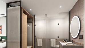 Une salle de bain moderne avec un meuble-lavabo en bois, un grand miroir et un espace douche.