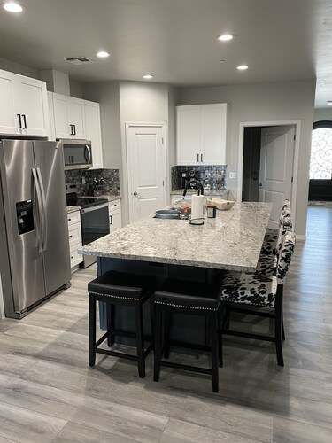 Brand new home,  55 ft garage. 3 bedrooms, sleeps 10.  18ft high garage door. 