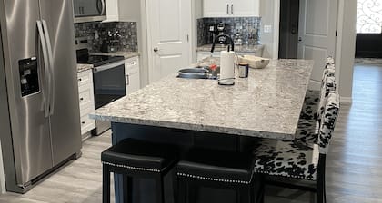 Brand new home, 55 ft garage. 3 bedrooms, sleeps 10. 18ft high garage door.