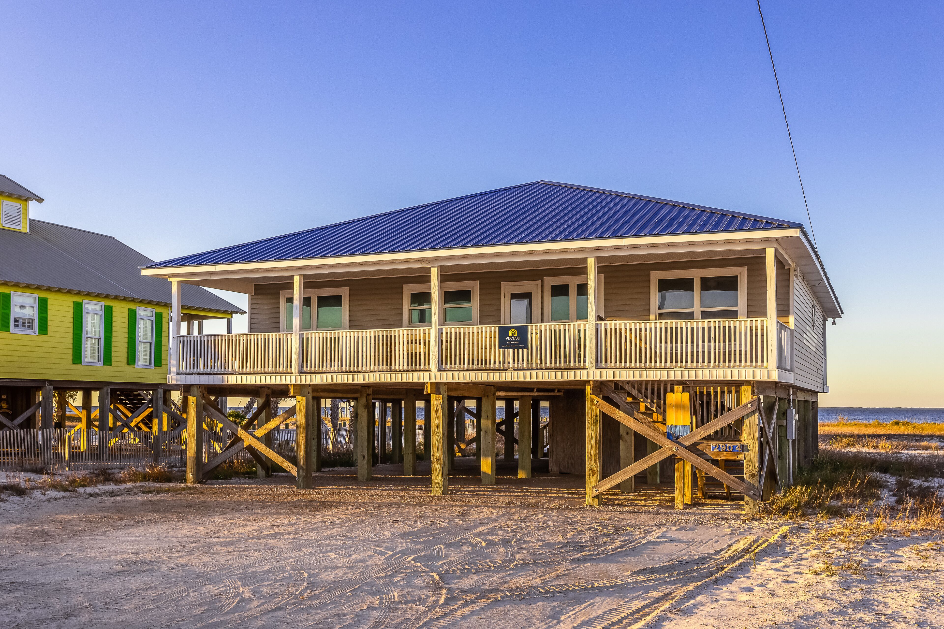 Beachfront home with private hot tub, ocean views, deck, central AC, and WiFi