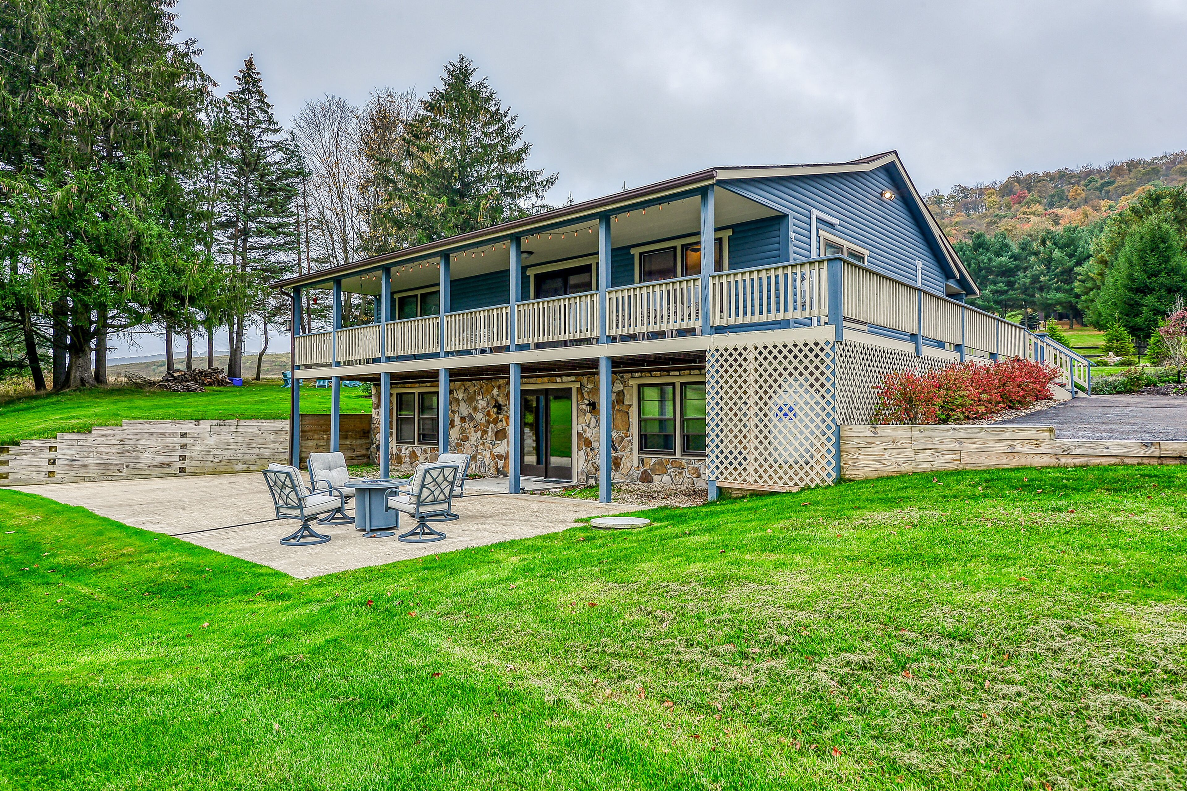 Dog-friendly home with private pond, wraparound porch & fireplaces