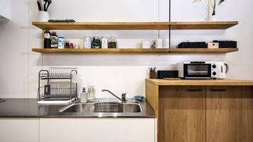 Fridge, microwave, toaster oven, cookware/dishes/utensils