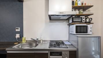 Fridge, microwave, cookware/dishes/utensils