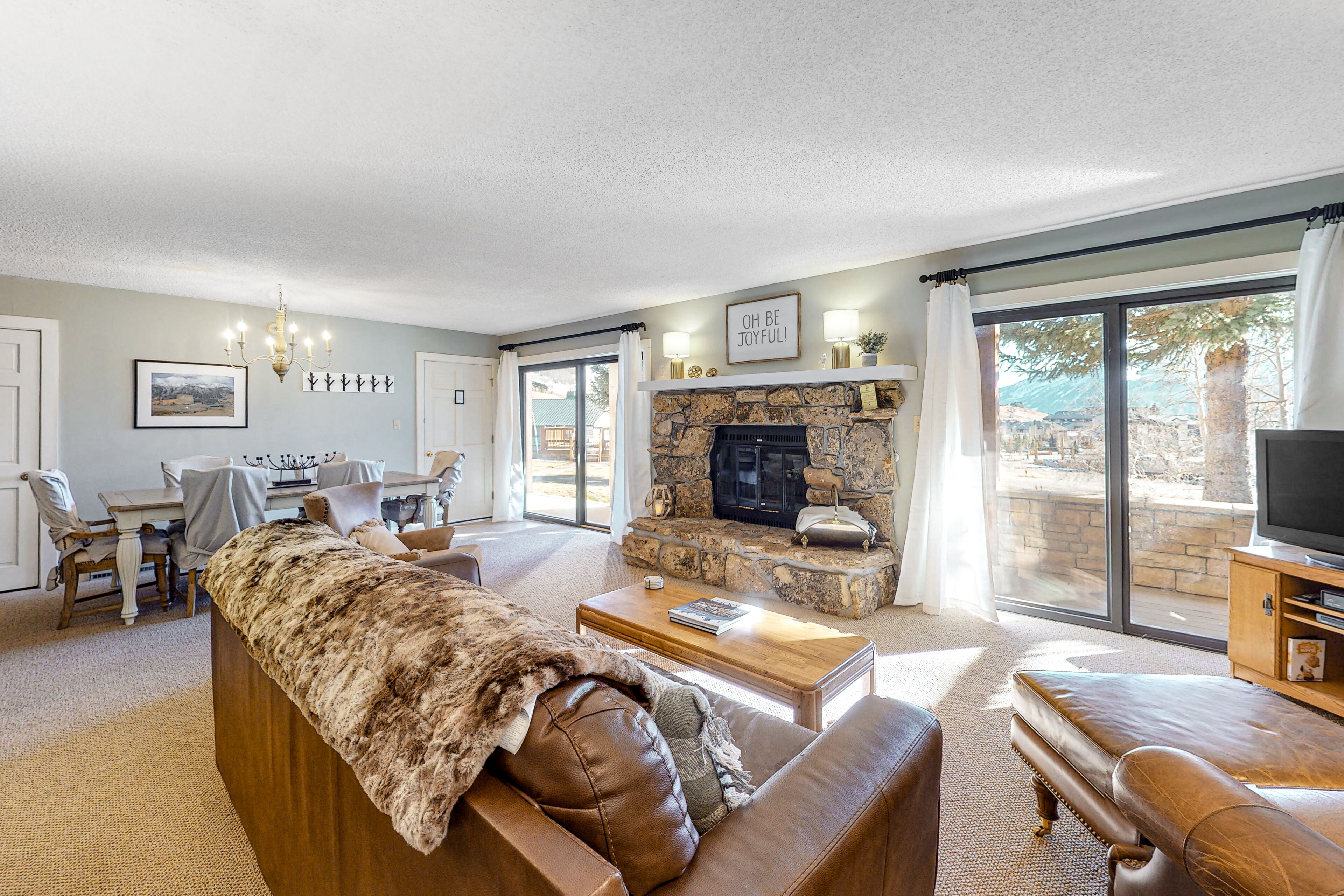 Mountain-view condo with private deck, fireplace & hot tub