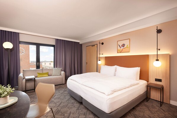 Hypo-allergenic bedding, in-room safe, laptop workspace