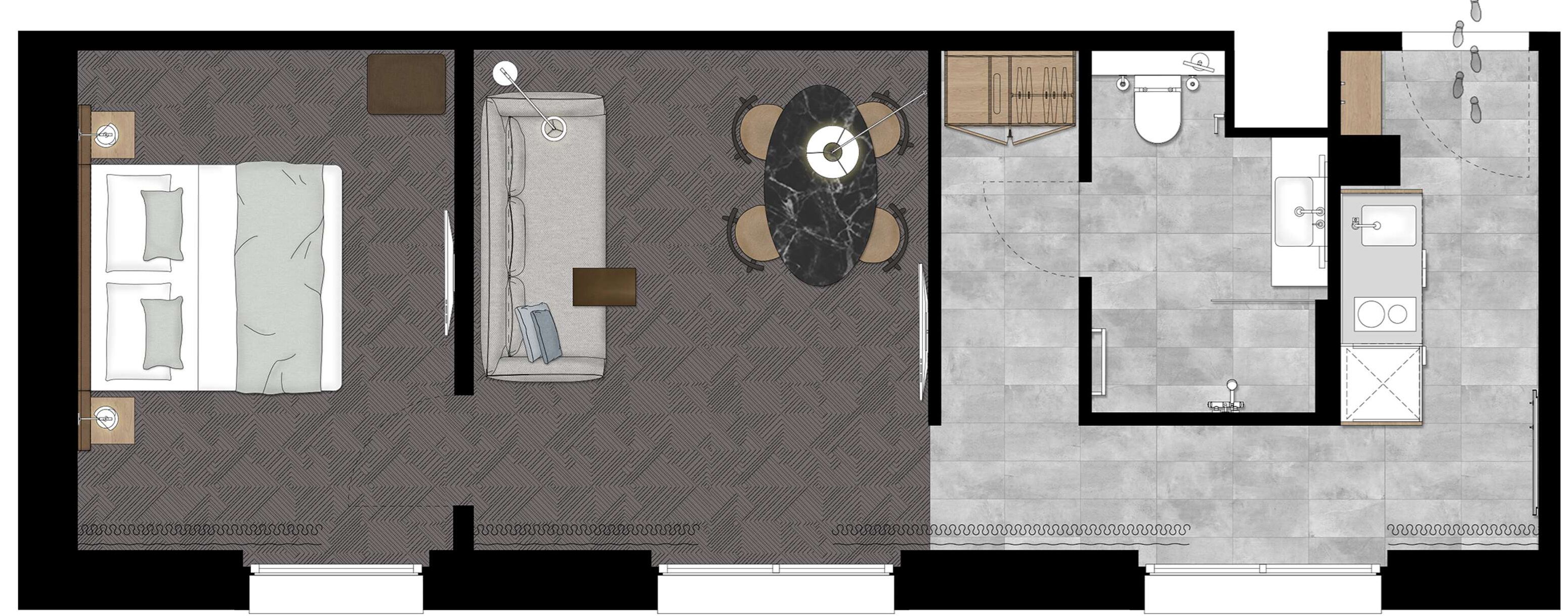 A hotel room layout with a bed, bedside table, and a small sitting area with a table and chairs.