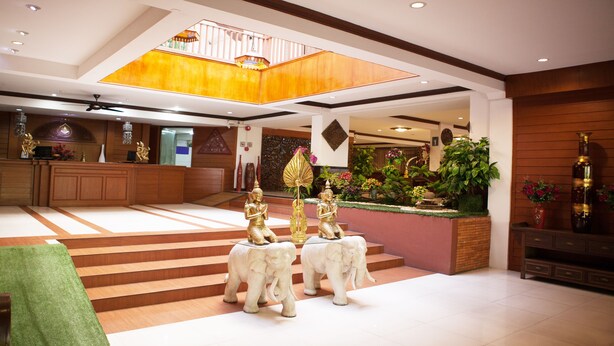 A spacious lobby with a high ceiling, a reception desk, and a staircase leading to an upper level. - B2 Chang Phueak Gate Premier Hotel (Chiang Mai)
