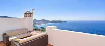 Holiday home with stunning sea views, private garden, shared pool & Wi-Fi