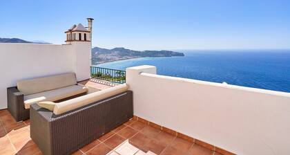 Holiday home with stunning sea views, private garden, shared pool & Wi-Fi