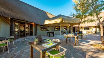 Breakfast, lunch served; local and international cuisine, pool views