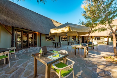 Breakfast, lunch served; local and international cuisine, pool views