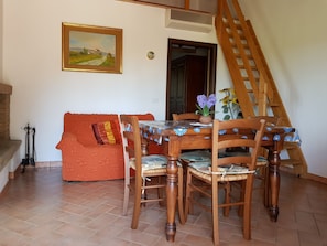 Family Apartment | Living area | 30-inch TV with satellite channels, fireplace