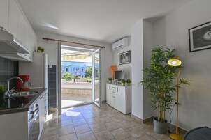 Apartamento | Cozinha privada | Geladeira, fogão, cooktop, cafeteira/chaleira