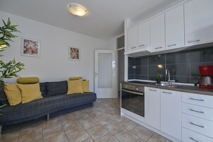 Apartamento | Cozinha privada | Geladeira, fogão, cooktop, cafeteira/chaleira